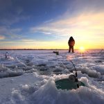 Ice Fisher at Sunset Patiently Waiting